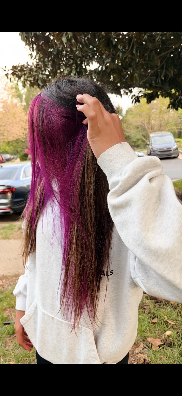 Long brunette hair with vivid magenta custom color panel