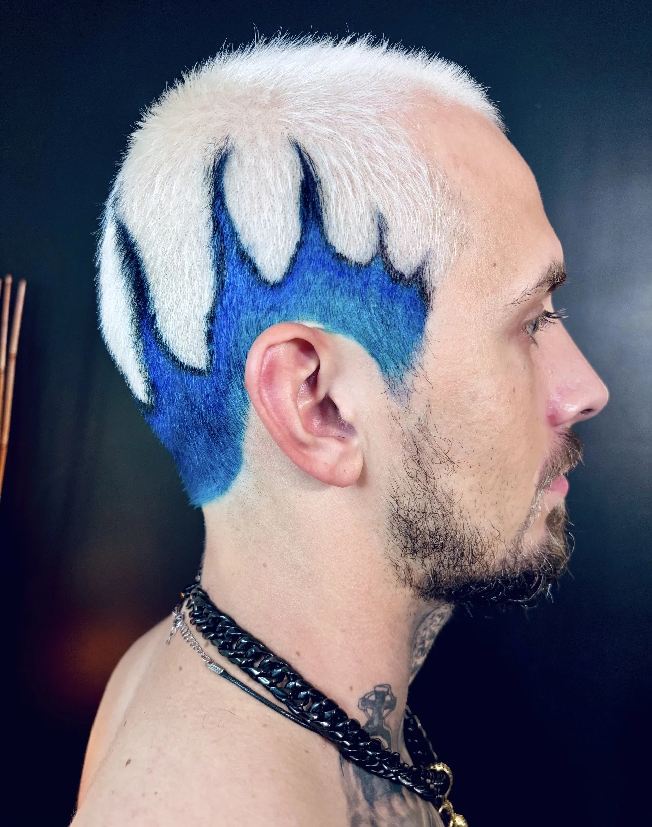 Short white and electric blue custom haircut viewed from the side