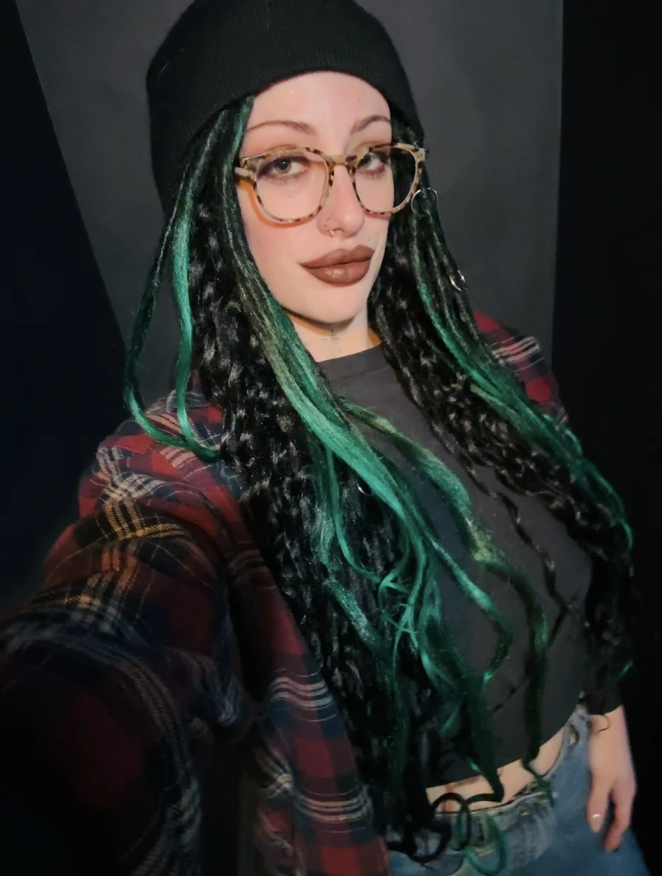 Black dreadlocks with vivid teal accent strands